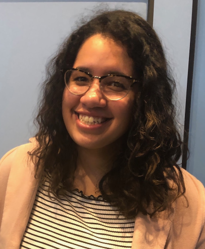 Headshot of student Gabriella Ortiz who is wearing a light pink blazer over a striped shirt.