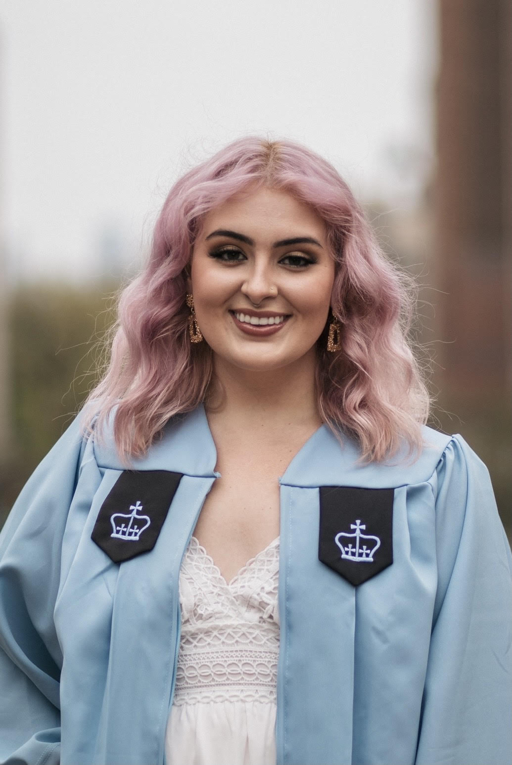 Headshot of Kennedy Ellender in her graduation rob.