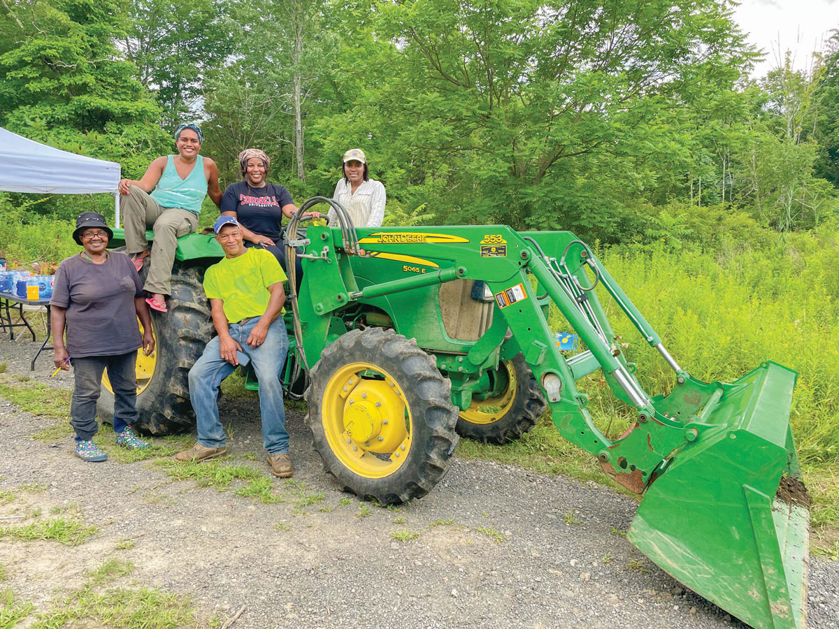 Farmers sit on a tractor 