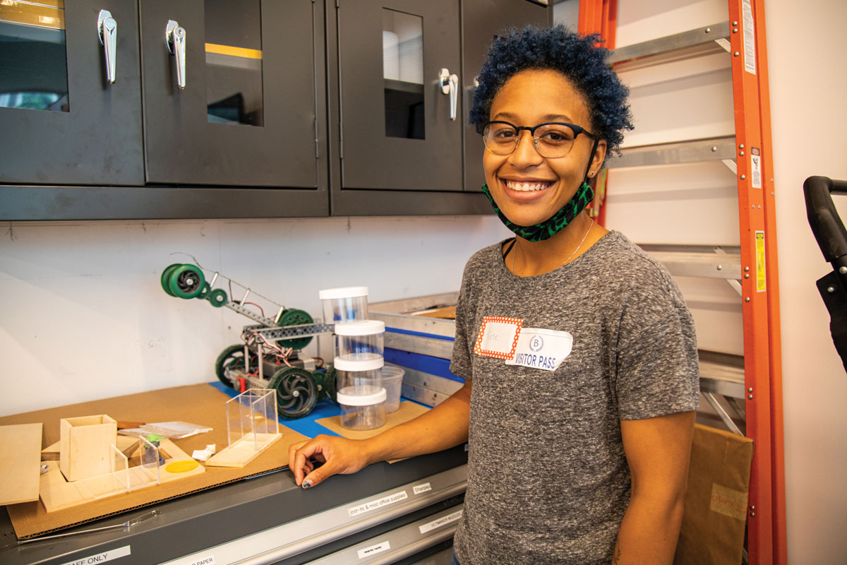 A visitor standing in a lab