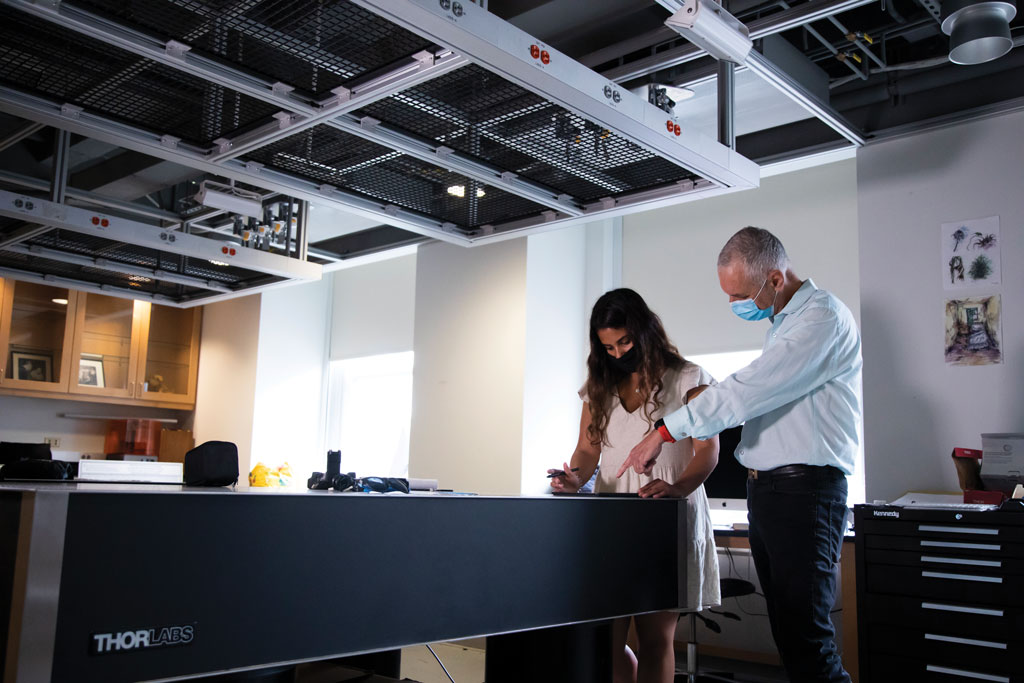 student and professor working together