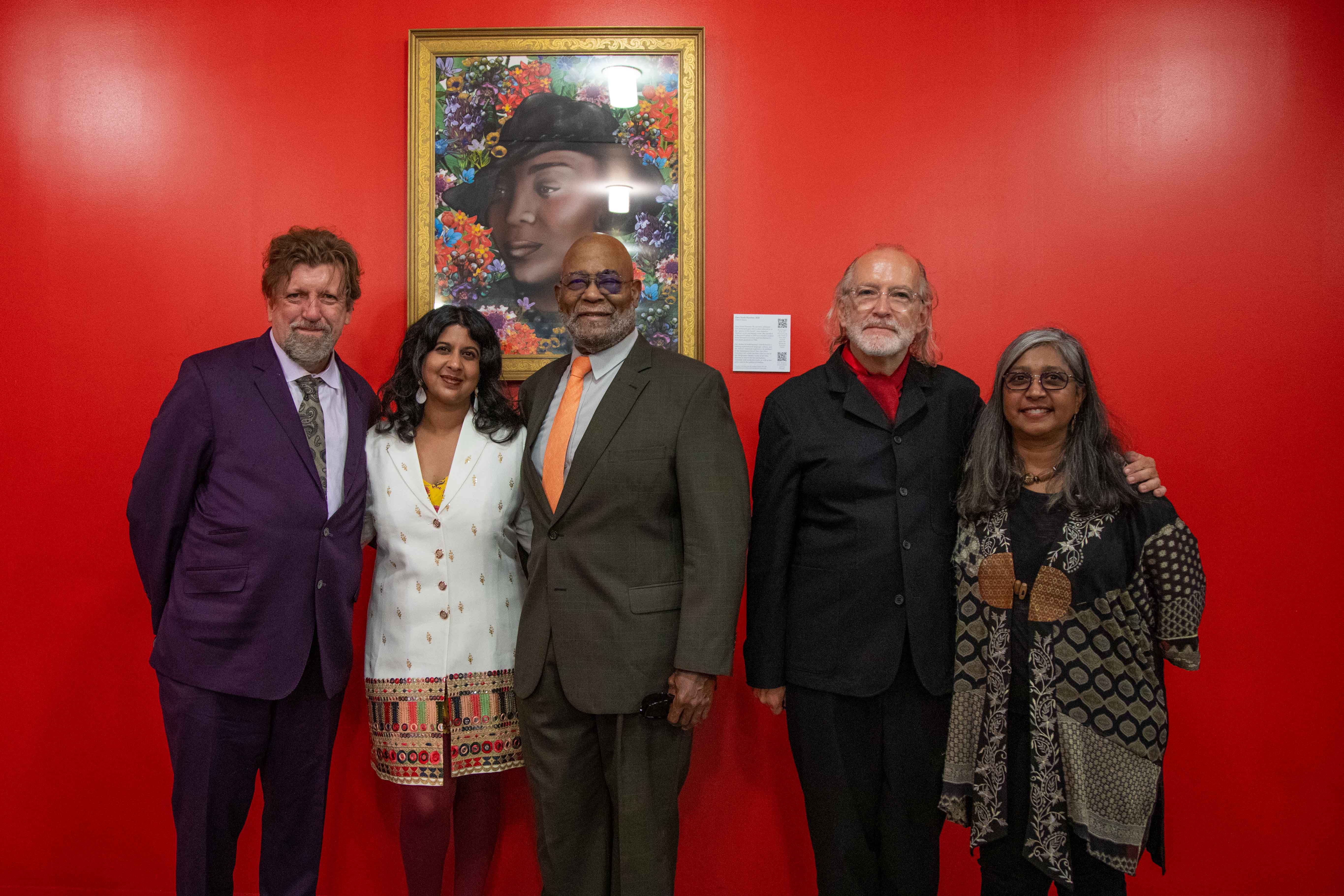 Oskar Eustis, the Public Theater’s director of new work development Amrita Ramanan, Donald Sutton, Public Theater managing director Jeremy Adams, and Premilla Nadasen, in front of a portrait of legendary writer Zora Neale Hurston ’28 