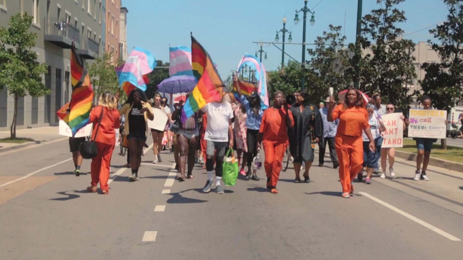 Protesters march down a street in CANS Can’t Stand