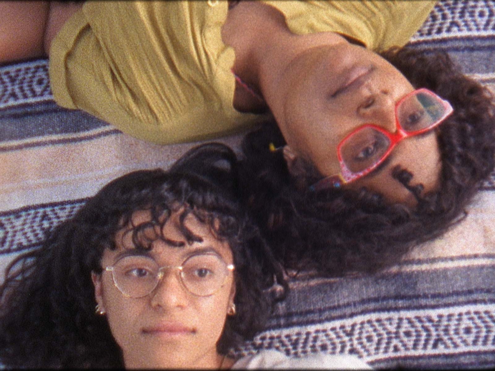 2 women's faces, close up, as they look straight up, from Still Waters