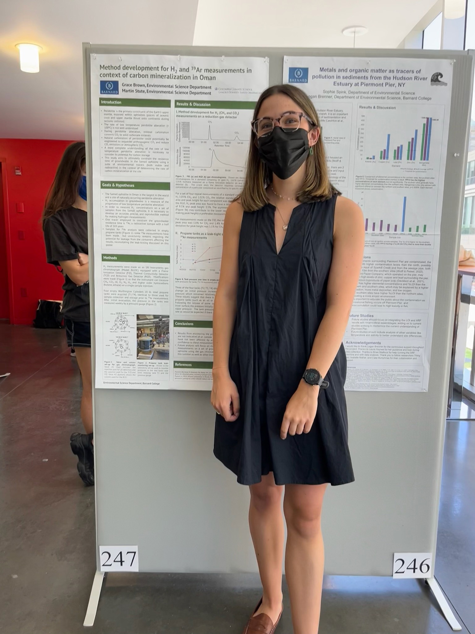 Woman wearing black dress and black face mask