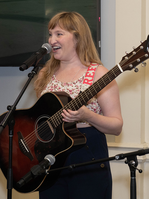 Katy Frame '03 performs for her class dinner.