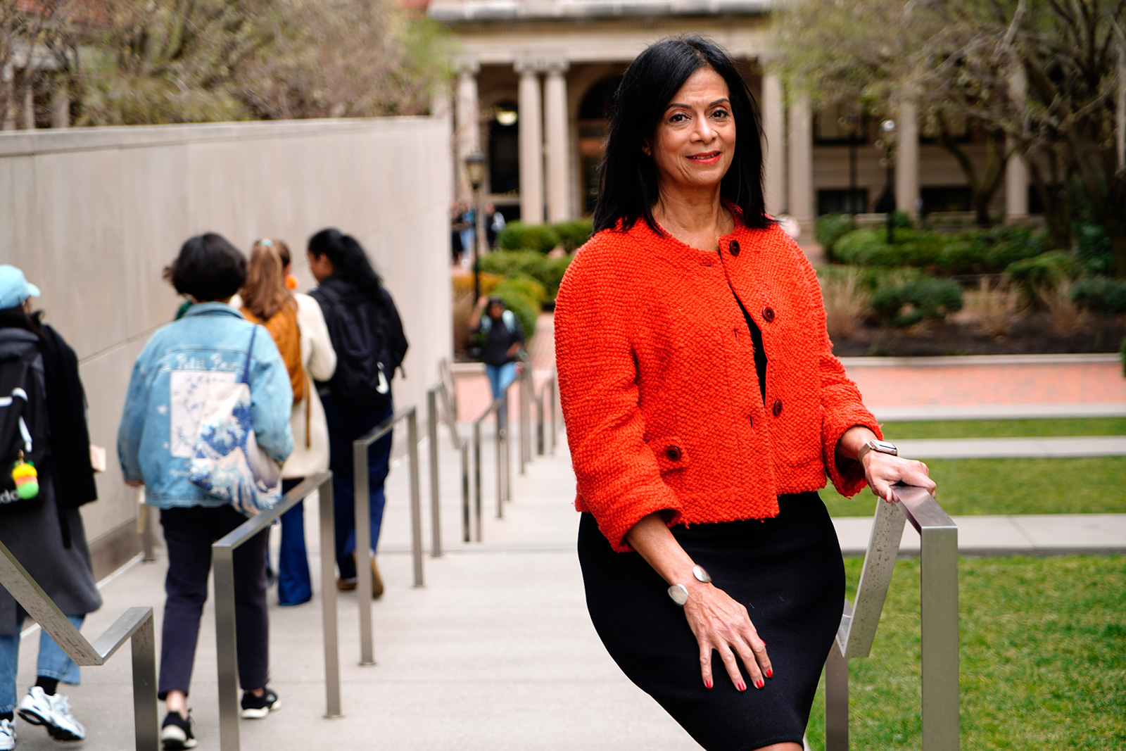 Akosua-Barthwell-Evans-’68 wearing red jacket and black dress on Barnard campus