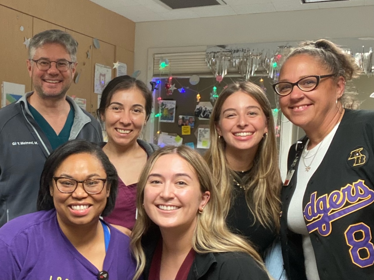 Rebecca poses with her clinical summer research coworkers.