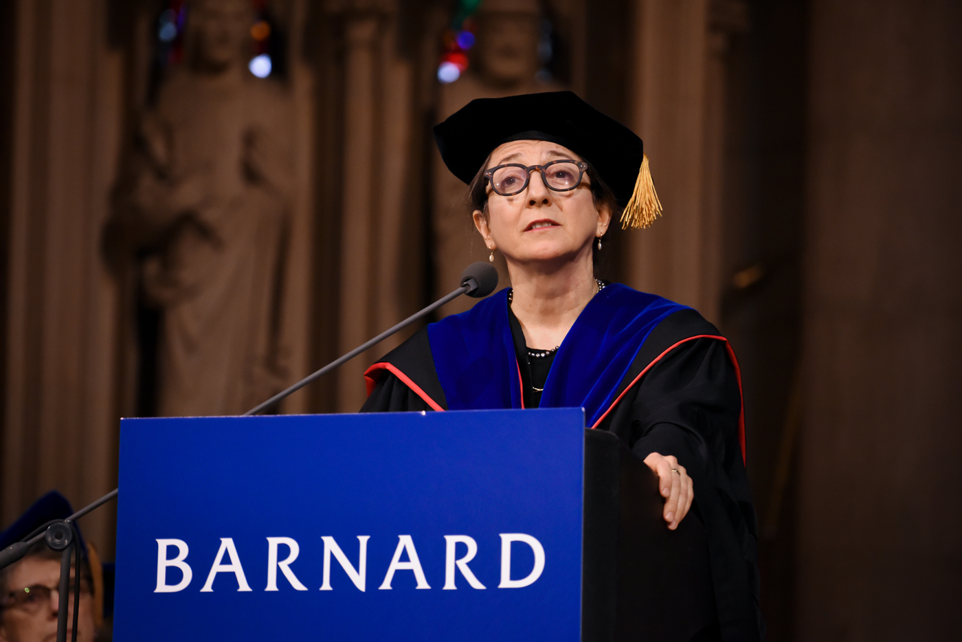 Saskia speaking at Barnard in regalia