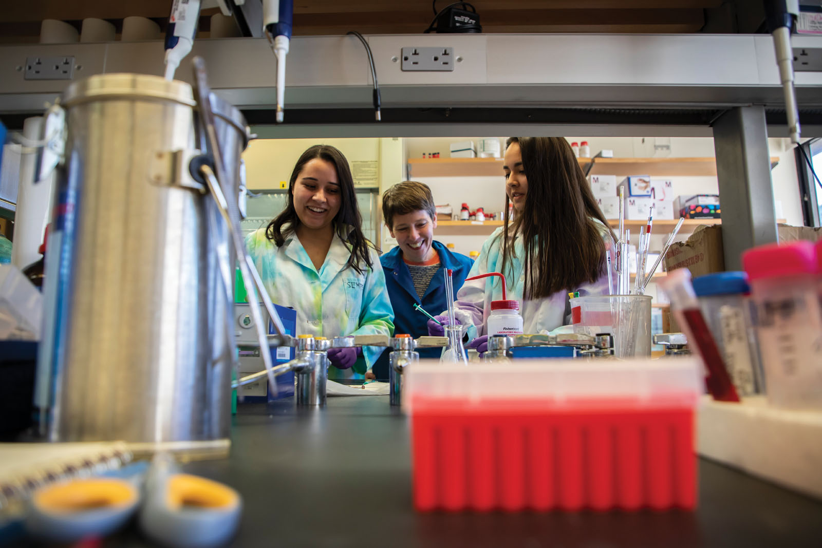 students and advisor in chem lab