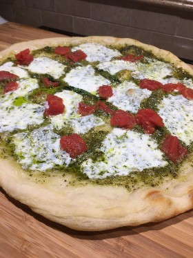 Homemade pesto and sundried tomato pizza.