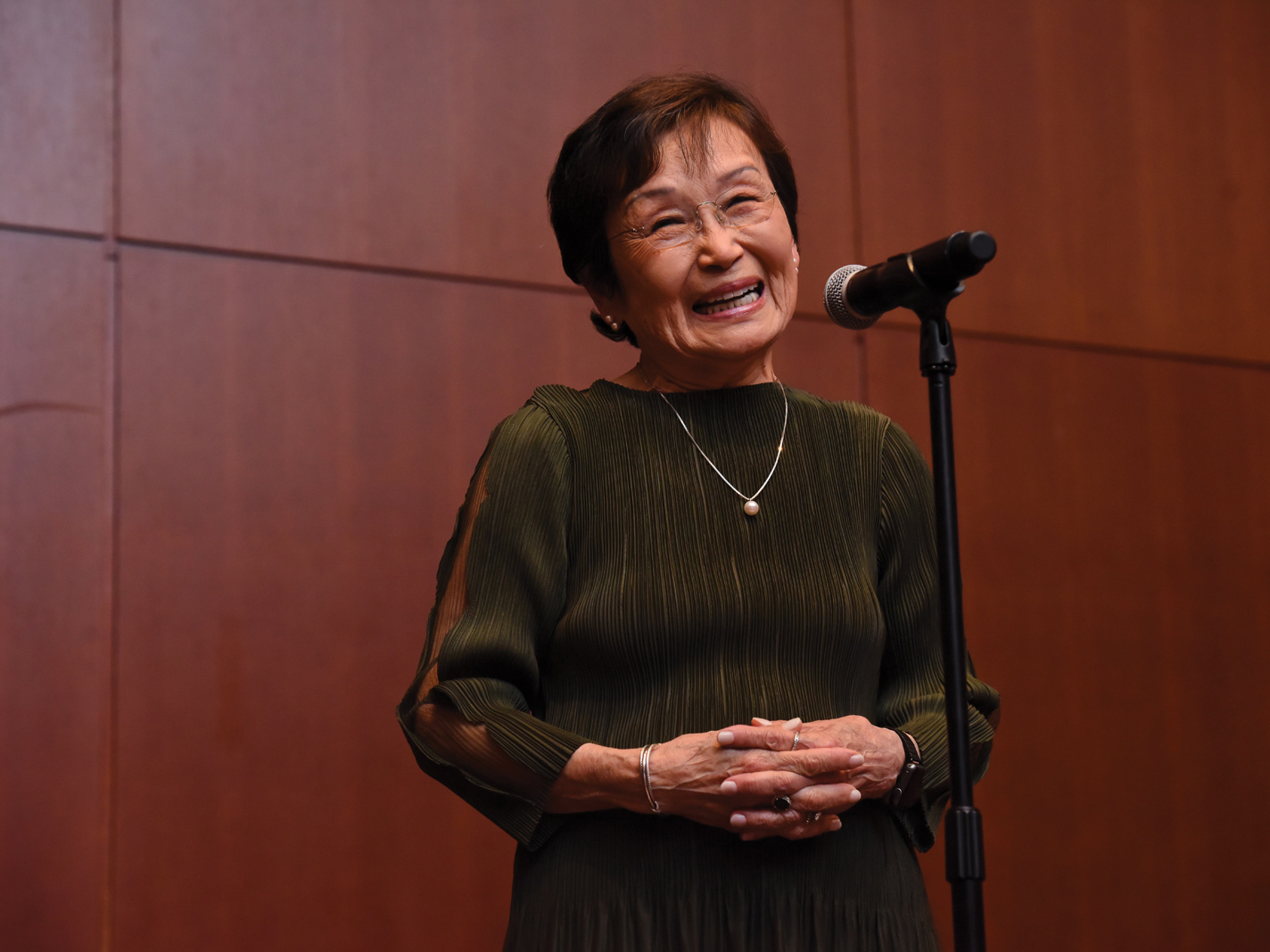 woman speaking into microphone