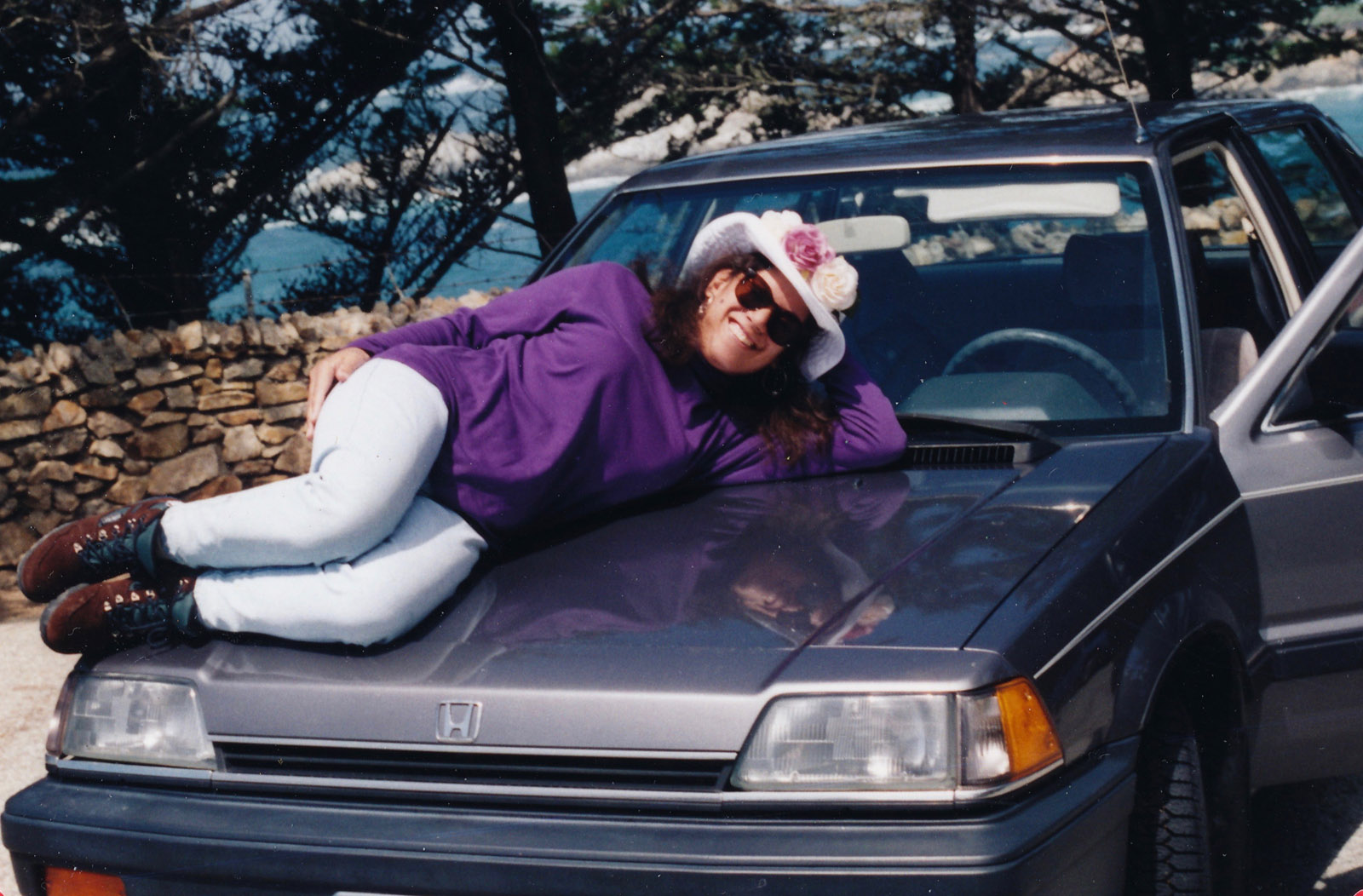 Claudia on the hood of the car