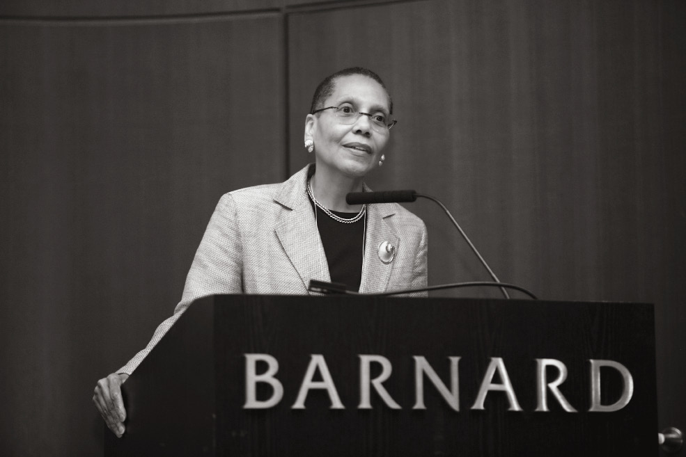 Woman speaking at a podium.