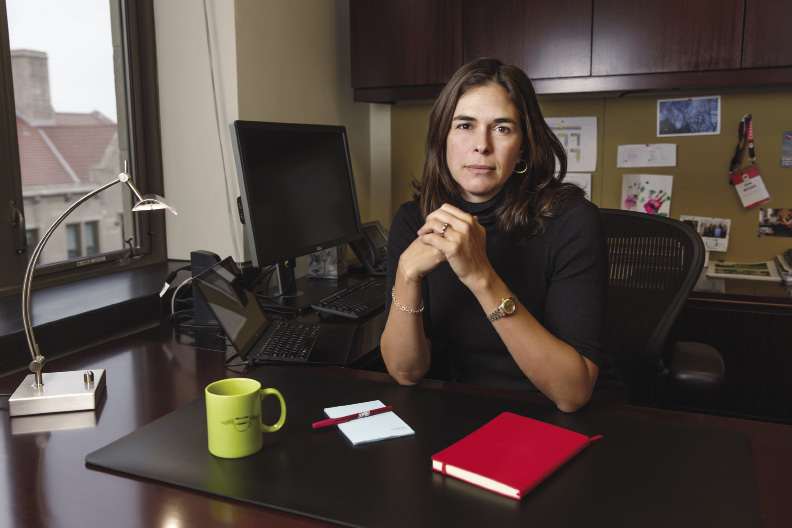 Woman sitting at her desk.