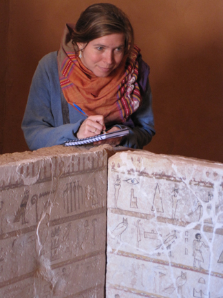 Ellen Morris examining a sarcophagus in Dakhleh Oasis