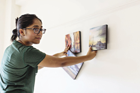 Sharon Mathew hanging photos