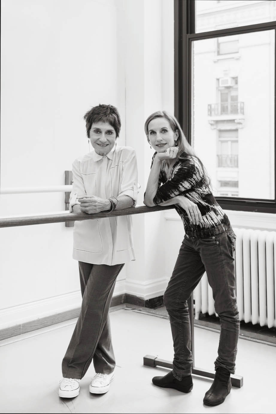 2 women posed in a dance studio