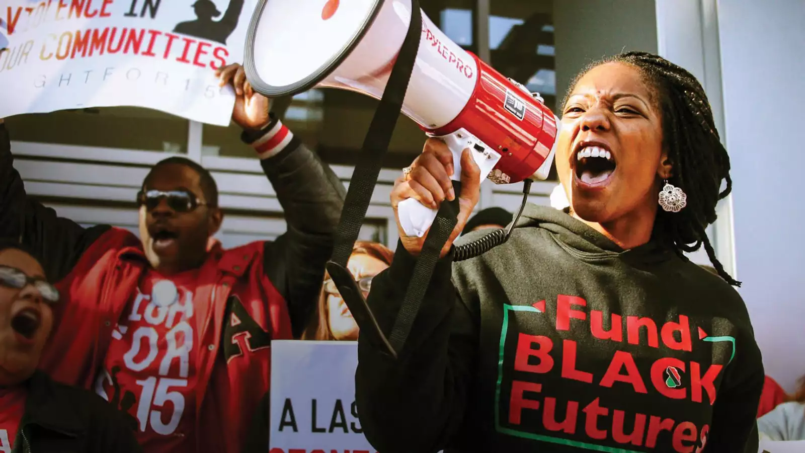 A woman shouts into a megaphone