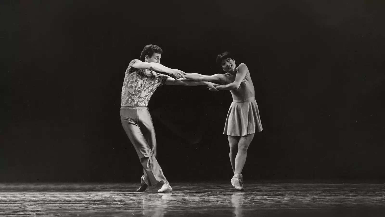 Black and white photo featuring a male/female dancers