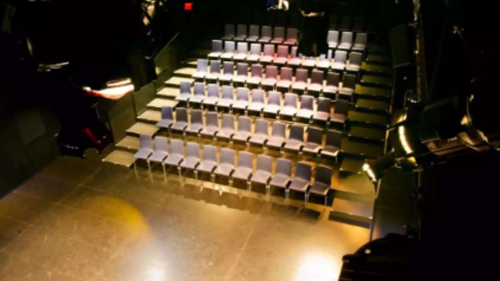 several rows of empty theater seats