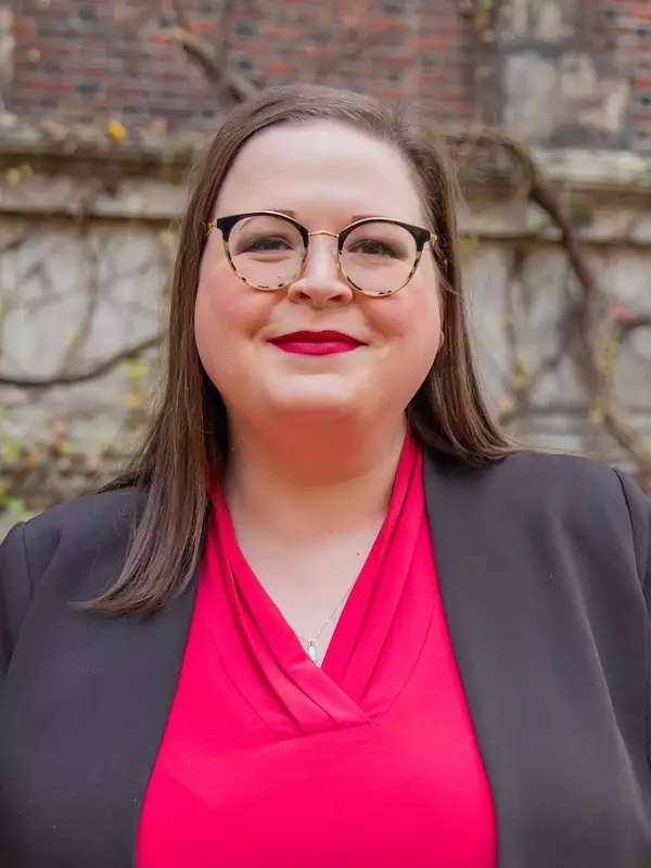 mixed background, woman smiling with red lips, pink top and gray blazer