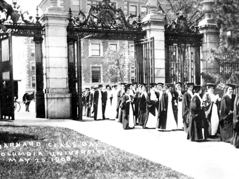 Barnard graduates marching through the College gates in 1908