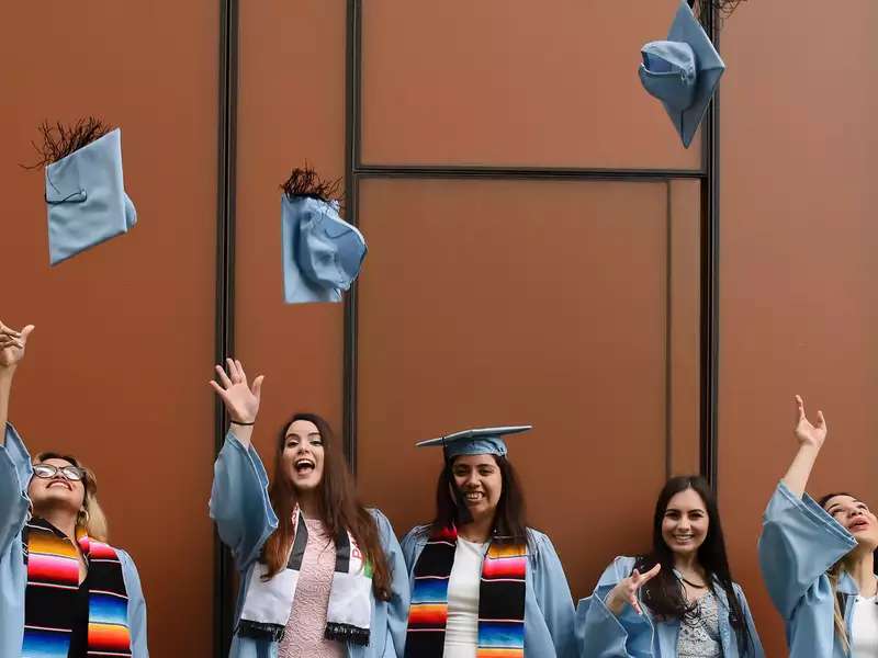 Grads throwing caps