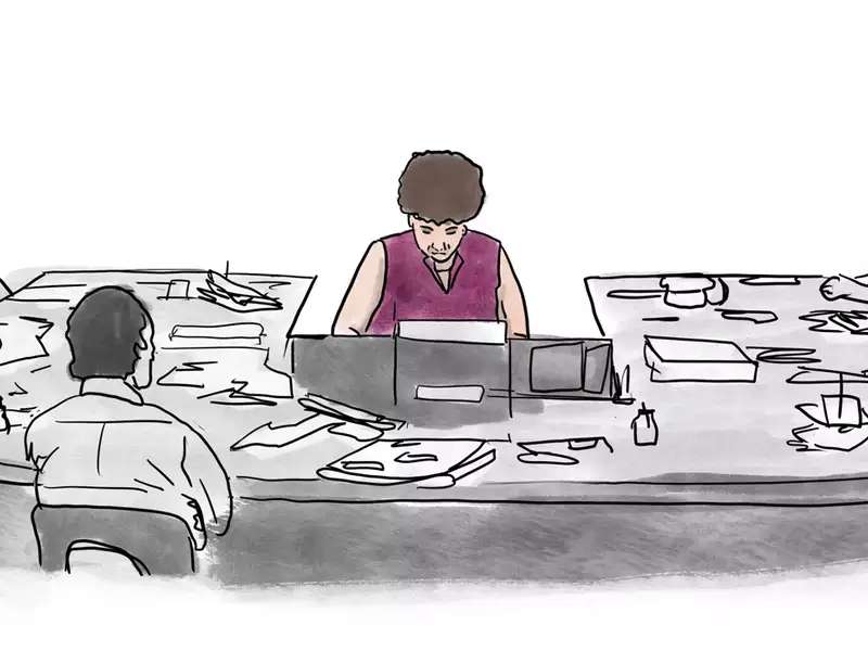 A woman working at a conference table