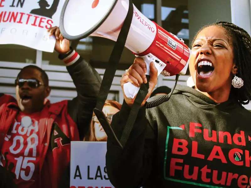 A woman shouts into a megaphone