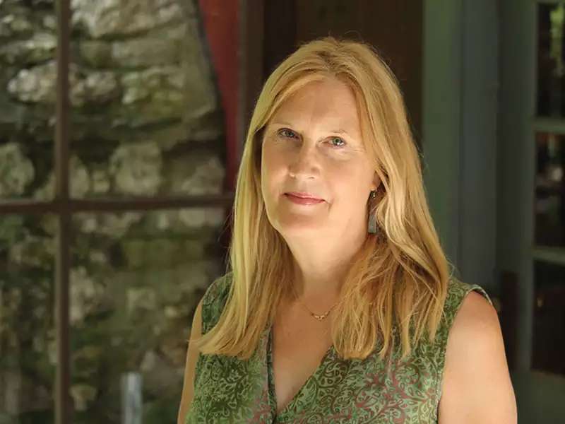 Jennifer Finney Boylan in green blouse with blurred background