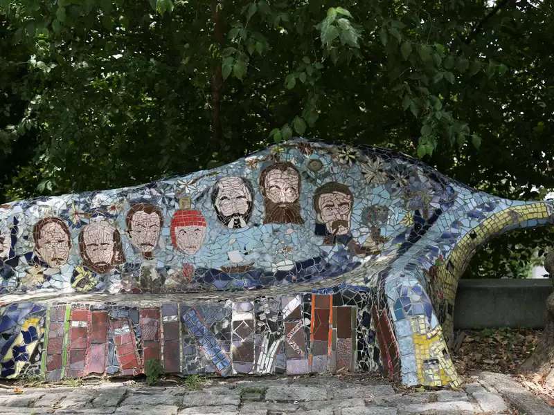 A bench decorated in mosaic tiles outside Grant's Tomb