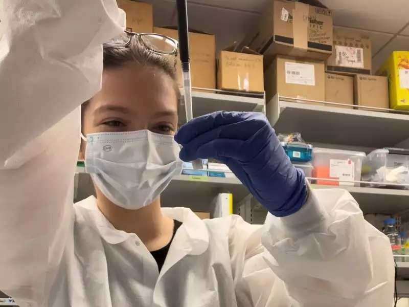 Barnard biology student using a micropipette