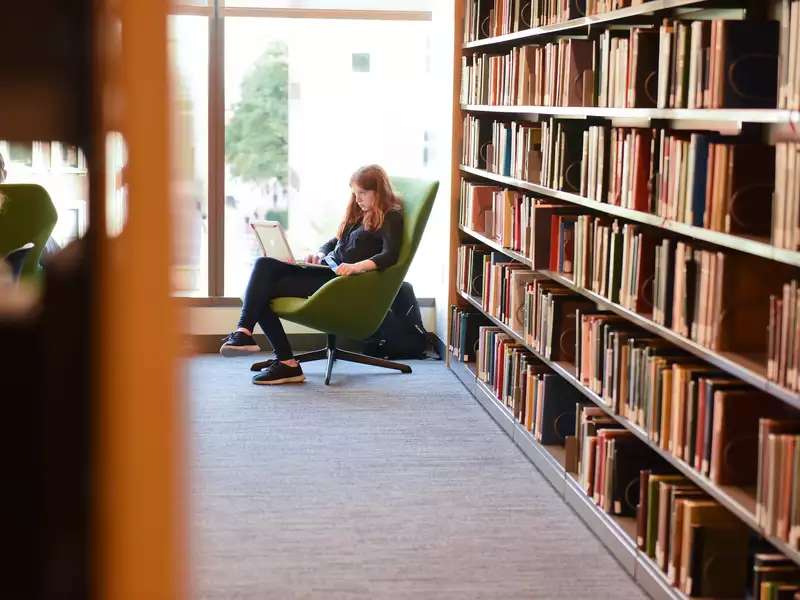 Student reading in the library