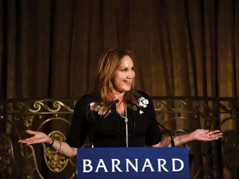 Woman speaking behind a podium