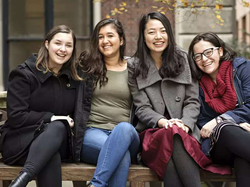 Image of four Barnard student sitting