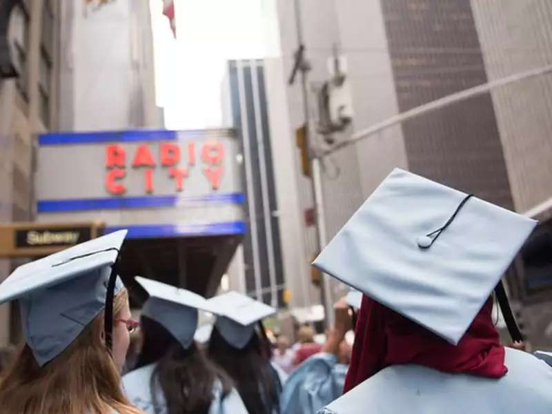 Barnard grads in graduation regalia, headed to Radio City